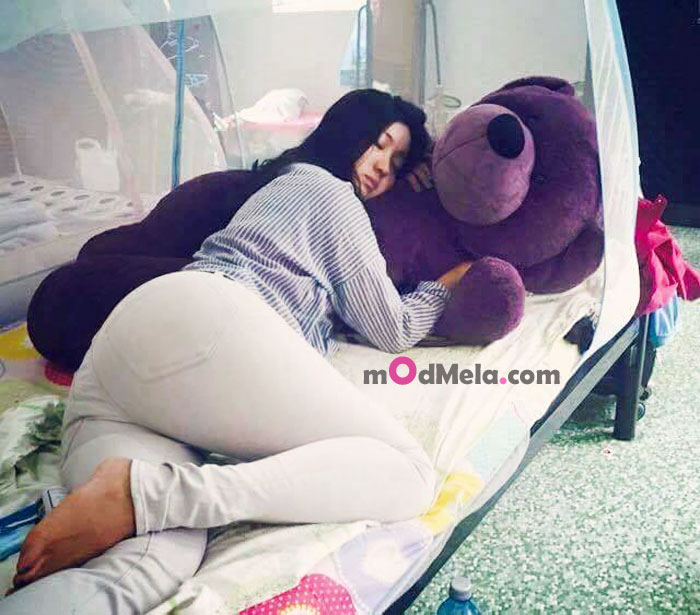 Cute girl sleeps with teddy