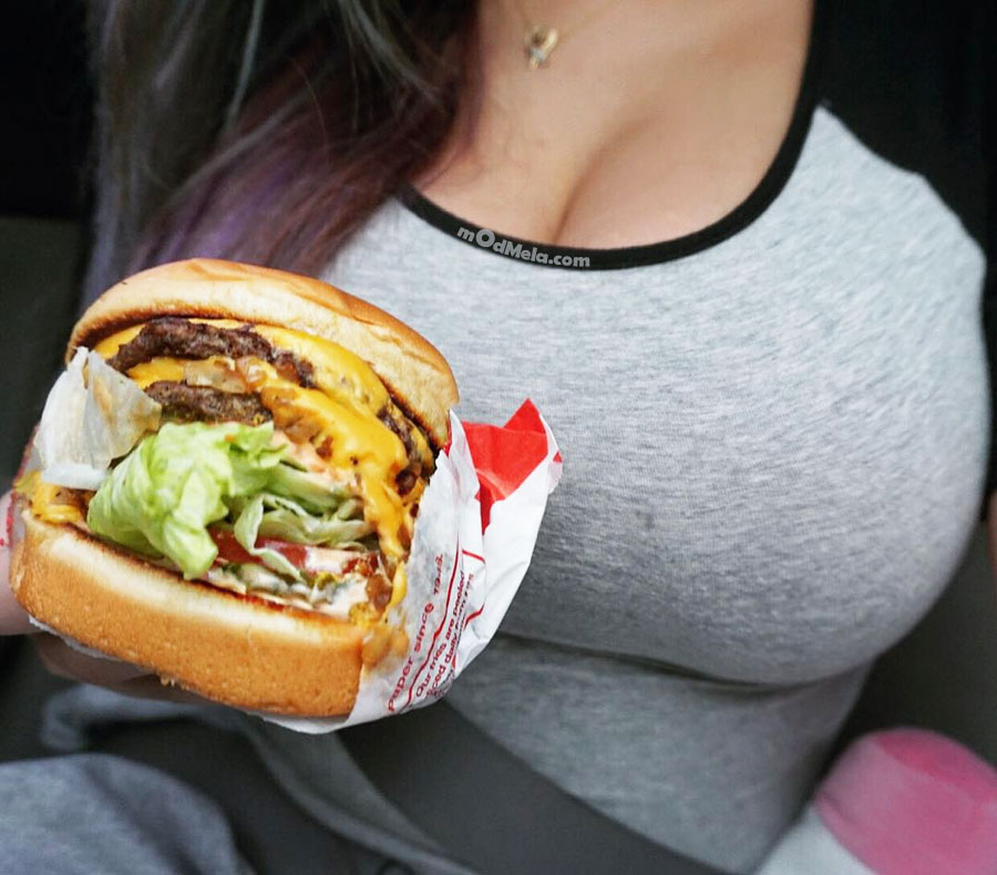 delicious burger Girl eats big burger