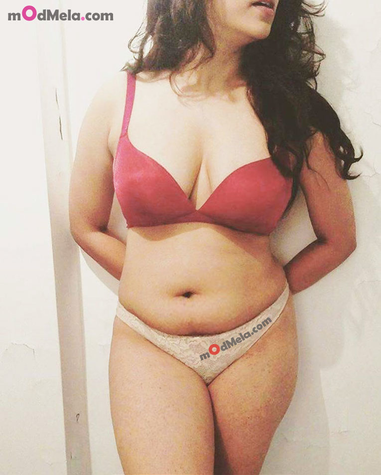 hiding birthday gift behind lingerie cream panties n red Bra